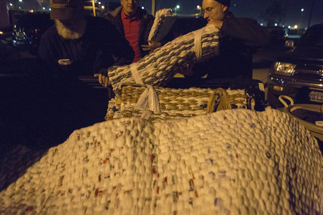 Plastic bag woven laying mats are distributed to individuals off of H Street and Bonanza Road in Las Vegas, Monday, Nov. 20, 2017. Elizabeth Brumley Las Vegas Review-Journal @EliPagePhoto
