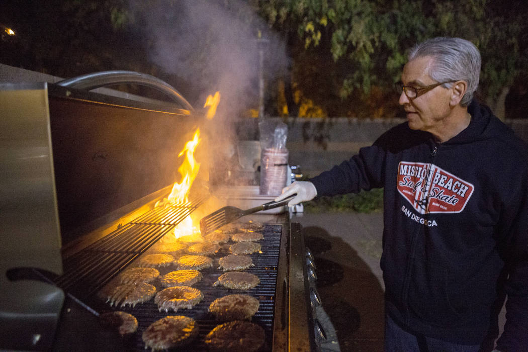 Knights Of Columbus councilmen Tony Vito grills burgers at Our Lady of Las Vegas to be given out to individuals in need in Las Vegas, Monday, Nov. 20, 2017.  Elizabeth Brumley Las Vegas Review-Jou ...