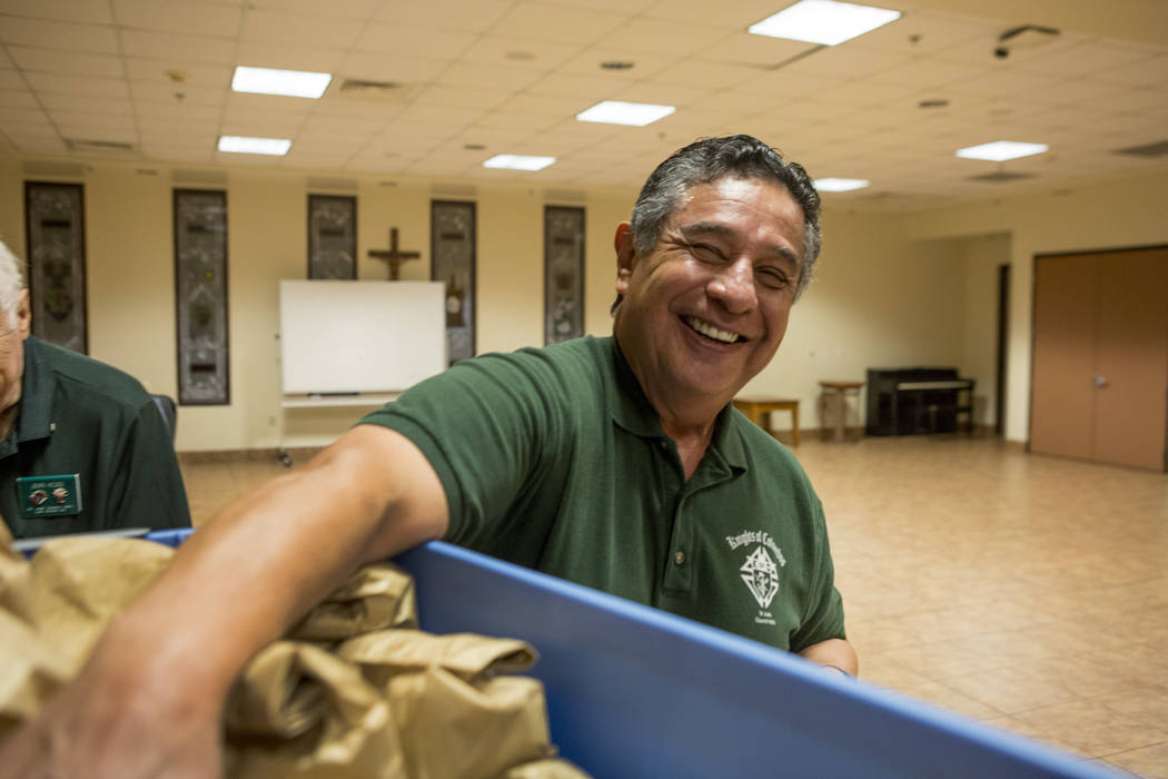 Knights Of Columbus councilmen Joe Suarez packs dinners at Our Lady of Las Vegas to be given out to individuals in need in Las Vegas, Monday, Nov. 20, 2017.  Elizabeth Brumley Las Vegas Review-Jou ...