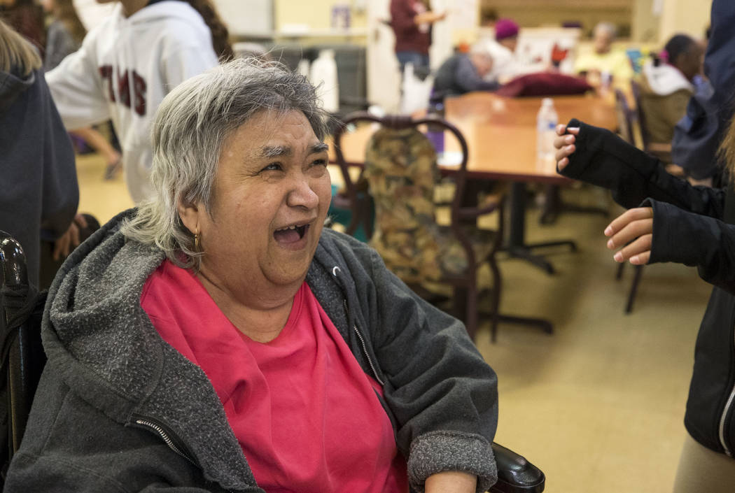 Bernadita Blas, 73, laughs as she talks with Faith Lutheran sixth graders volunteering at the Nevada Senior Services Adult Day Care Of Las Vegas on Friday, Nov. 17, 2017. Richard Brian Las Vegas R ...