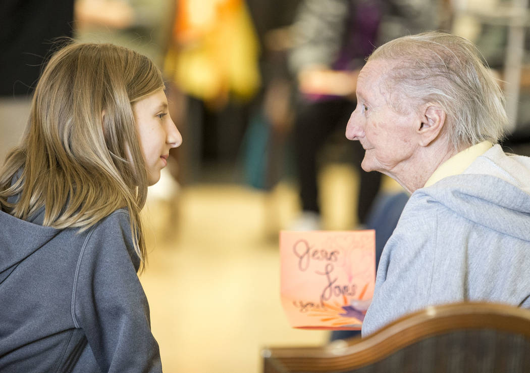 Faith Lutheran sixth-grader Rylan Dettling, 11, talks with Linda Brady, 78, as she volunteers at the Nevada Senior Services Adult Day Care Of Las Vegas on Friday, Nov. 17, 2017. Richard Brian Las  ...