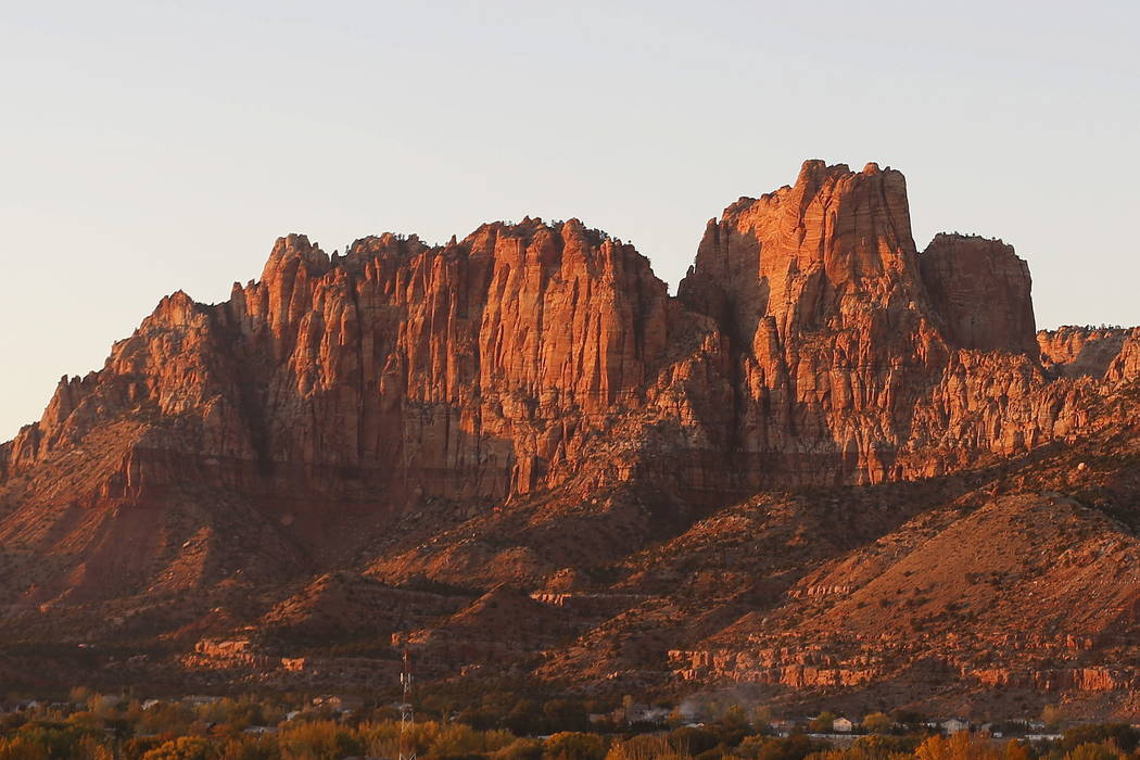 The mountains surrounding Hildale, Utah, and its sister city, Colorado City, Ariz., are seen at sunset last month.  (AP Photo/Rick Bowmer)
