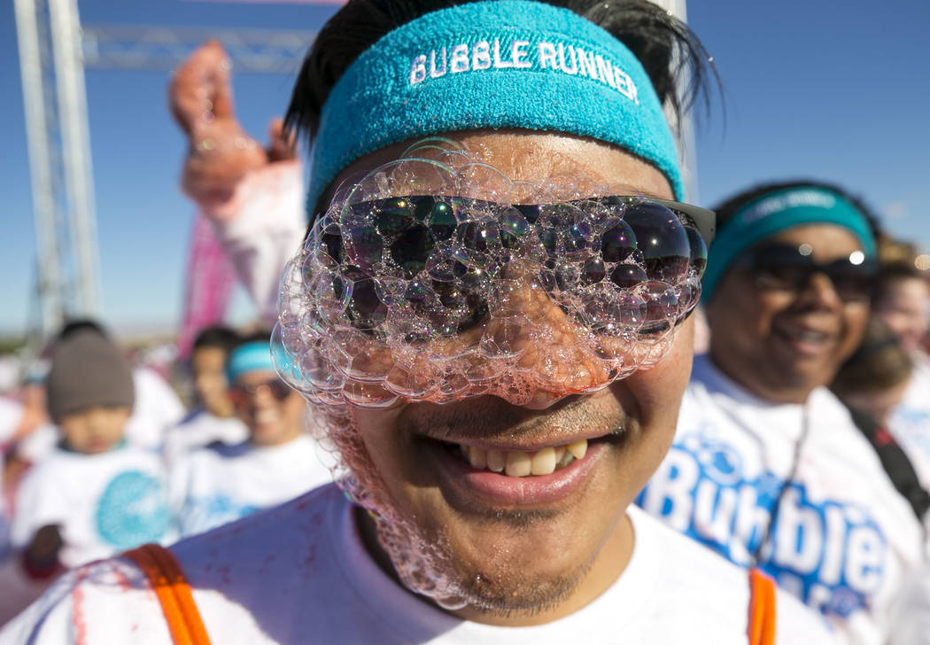 Las Vegas resident Augie Egbalic takes part in the Bubble Run 5K event at Sam Boyd Stadium in Las Vegas, Saturday, Nov. 18, 2017. Richard Brian Las Vegas Review-Journal @vegasphotograph