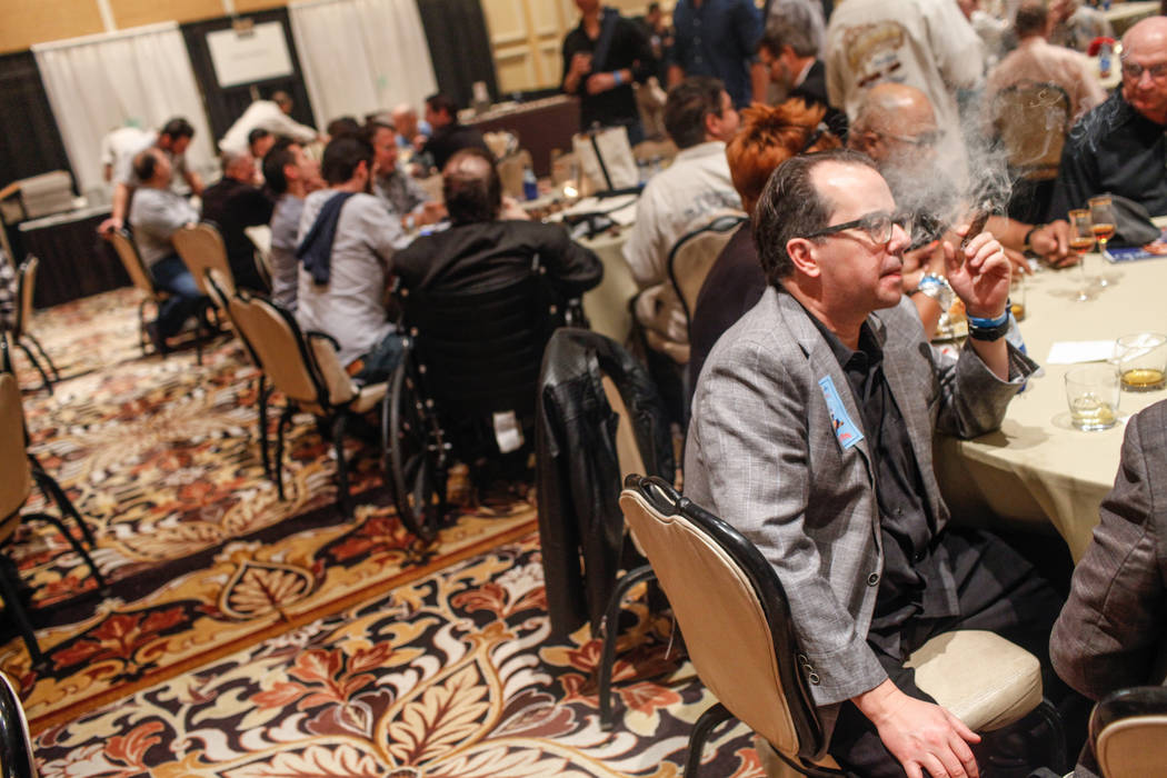 Matt Long of Seattle, 47, smokes a cigar during the Cigar Aficionado's Big Smoke Las Vegas weekend event at The Mirage in Las Vegas, Saturday, Nov. 18, 2017. Joel Angel Juarez Las Vegas Review-Jou ...