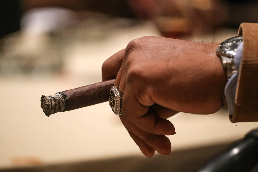 Ted Price, 65, of Chesapeake, Va., holds a cigar during the Cigar Aficionado's Big Smoke Las Vegas weekend event at The Mirage in Las Vegas, Saturday, Nov. 18, 2017. Joel Angel Juarez Las Vegas Re ...