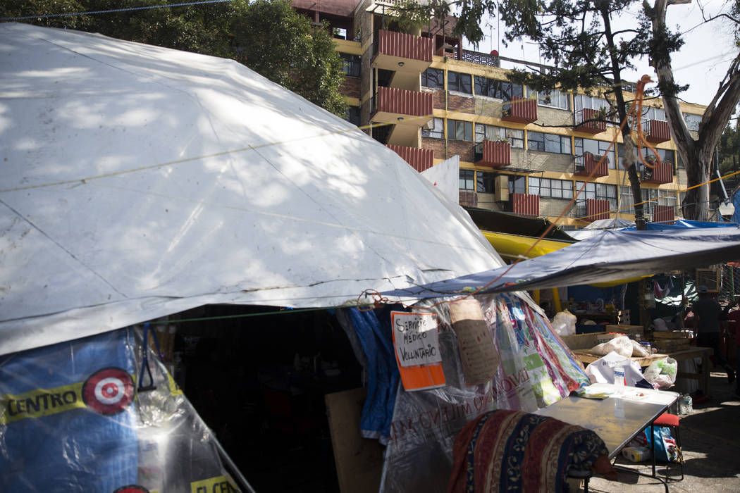 A medial tent outside of the uninhabited apartment complex, Unidad Habitacional de Tlalpan, which suffered structural damage during the Sept. 19 earthquake in Mexico City, Mexico, Friday, Nov. 17, ...
