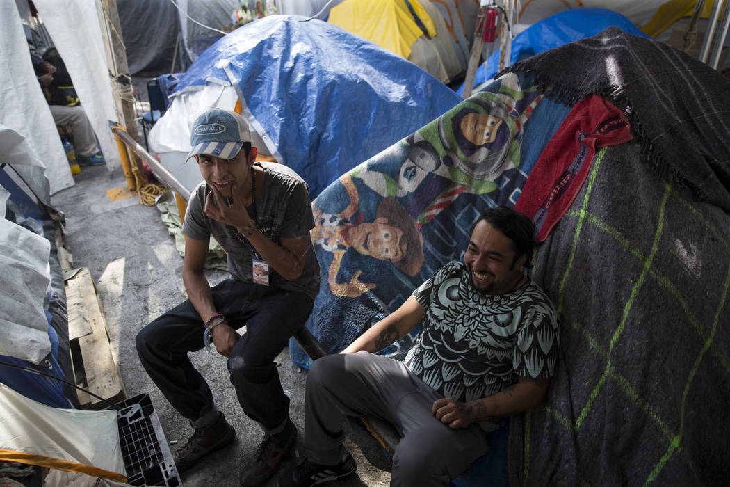 Eduardo Favela Castellanos, left, 25, and Jonathan Rodriguez, 33, who are now homeless living in tents after their apartment complex, Unidad Habitacional de Tlalpan, suffered structural damage dur ...