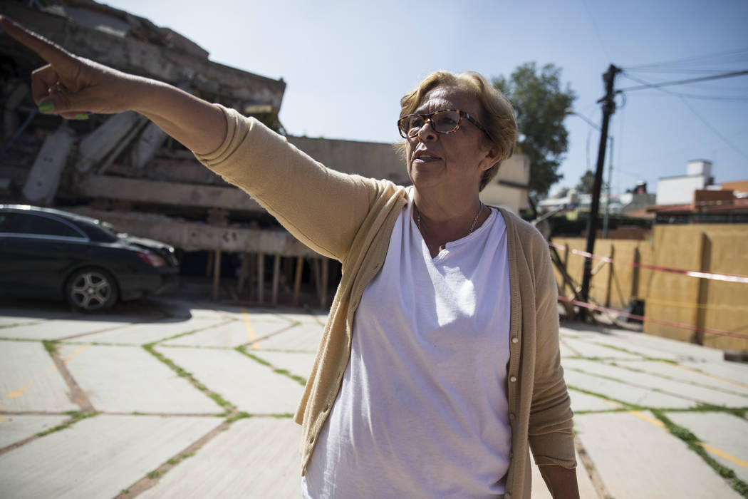 Georgina Godinez Cadena, who lives across adjacent to the Colegio Enrique Rebsamen elementary school, which collapsed during the Sept. 19 earthquake in Mexico City, Mexico, talks about the earthqu ...