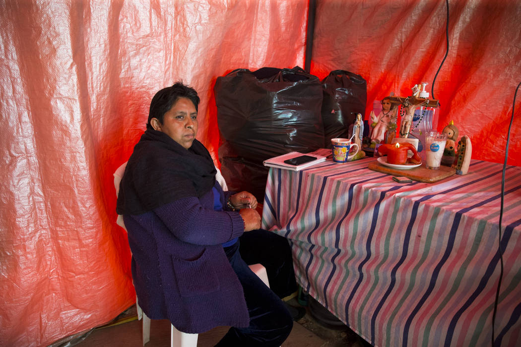 Olga Peralta Rosas, who watches an unhabitale apartment complex adjecent to the Colegio Enrique Rebsamen elementary school, which collapsed during the Sept. 19 earthquake in Mexico City, Mexico, w ...