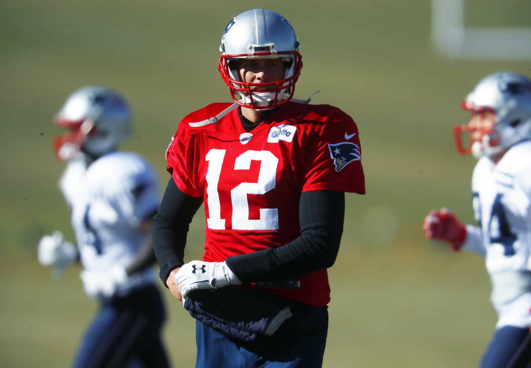 New England Patriots quarterback Tom Brady takes part in drills before practicing Wednesday, Nov. 15, 2017, on the campus of the Air Force Academy in Air Force Academy, Colo. The Patriots are prac ...