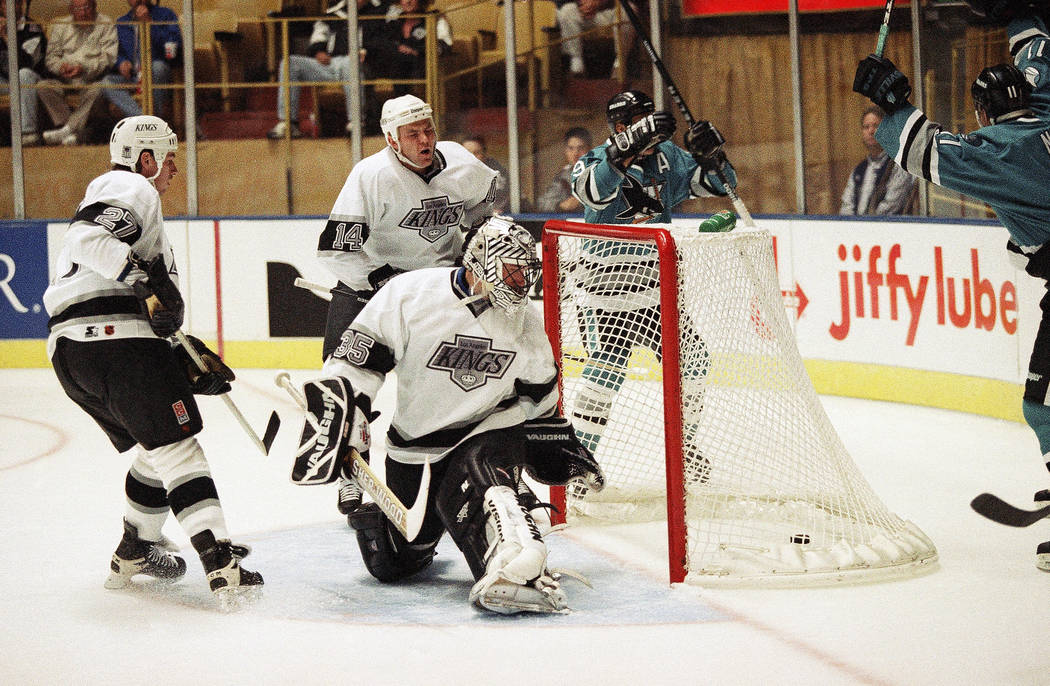 San Jose Sharks Bernie Nicholls, right, congratulates teammate Tony Granato after Granato scored the first goal against the Los Angeles Kings during their game, Sunday, Oct. 6, 1996 at the Forum i ...