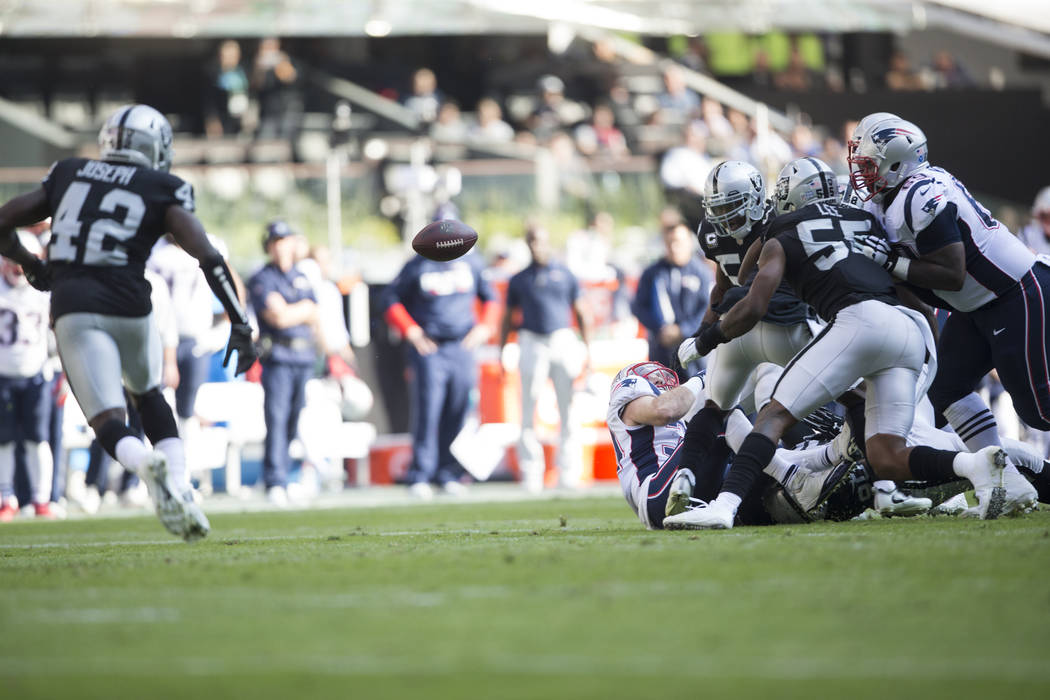 Oakland Raiders force a fumble against the New England Patriots in the NFL football game at Estadio Azteca in Mexico City, Sunday, Nov. 19, 2017. Erik Verduzco Las Vegas Review-Journal @Erik_Verduzco