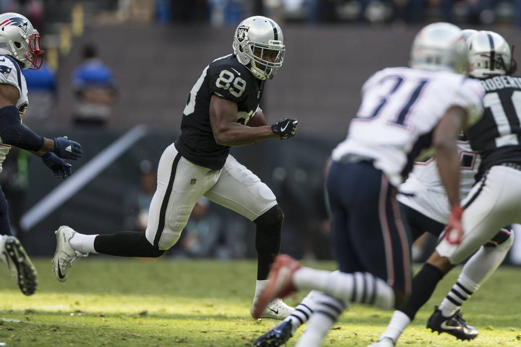Oakland Raiders wide receiver Amari Cooper (89) runs the ball against the New England Patriots in the NFL football game at Estadio Azteca in Mexico City, Sunday, Nov. 19, 2017. Erik Verduzco Las V ...