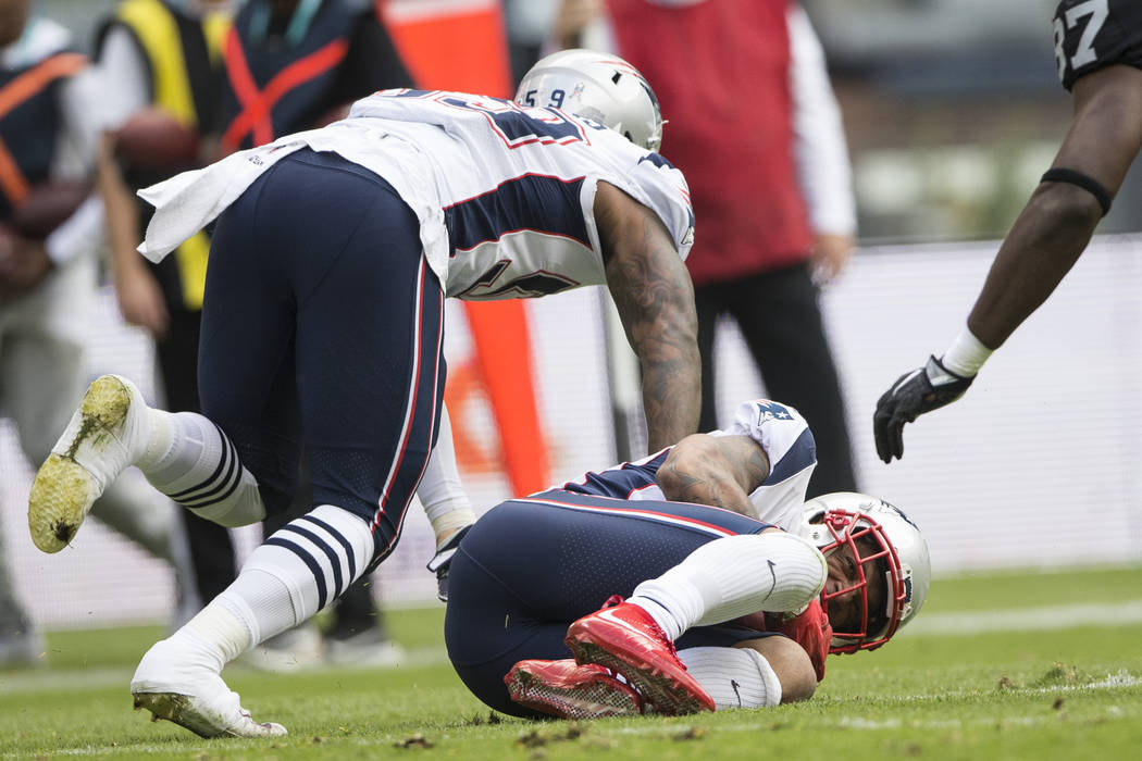 New England Patriots strong safety Patrick Chung (23) recovers a fumble the the Oakland Raiders in the NFL football game at Estadio Azteca in Mexico City, Sunday, Nov. 19, 2017. Erik Verduzco Las ...