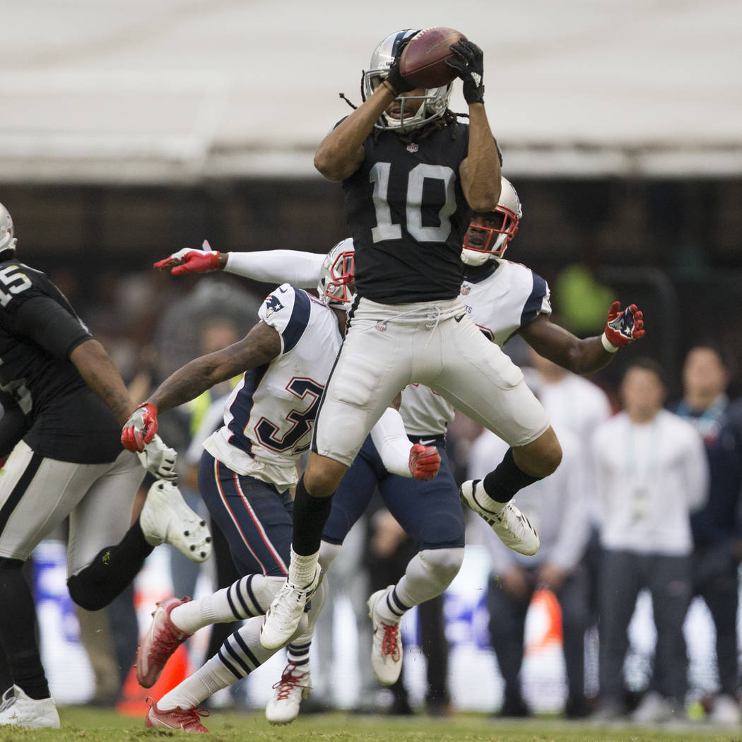 Oakland Raiders wide receiver Seth Roberts (10) makes a catch against the New England Patriots in the NFL football game at Estadio Azteca in Mexico City, Sunday, Nov. 19, 2017. New England Patriot ...