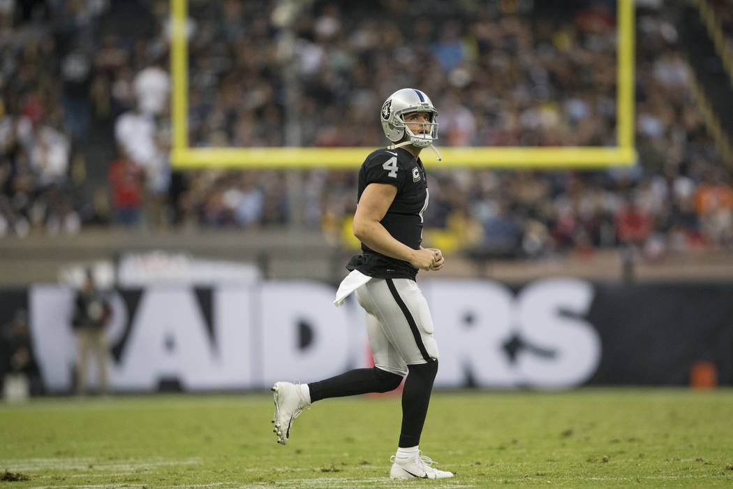 Oakland Raiders quarterback Derek Carr (4) during the NFL football game against the New England Patriots at Estadio Azteca in Mexico City, Sunday, Nov. 19, 2017. New England Patriots won 33-8. Eri ...