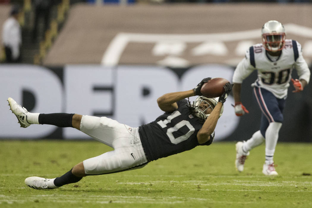 Oakland Raiders wide receiver Seth Roberts (10) makes a catch against the New England Patriots in the NFL football game at Estadio Azteca in Mexico City, Sunday, Nov. 19, 2017. New England Patriot ...