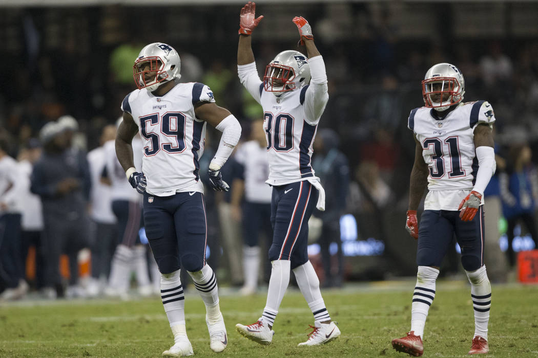 New England Patriots strong safety Duron Harmon (30) raises his arms as the clock winds down in the NFL football game against the Oakland Raiders at Estadio Azteca in Mexico City, Sunday, Nov. 19, ...