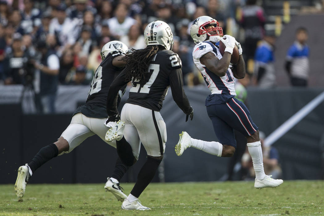 New England Patriots wide receiver Brandin Cooks (14) makes a catch against the Oakland Raiders in the NFL football game at Estadio Azteca in Mexico City, Sunday, Nov. 19, 2017. Erik Verduzco Las  ...