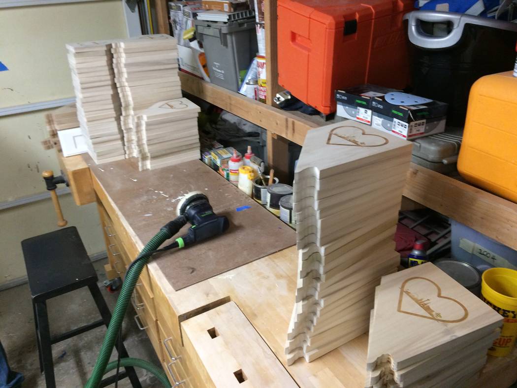 Plaques ready for sanding are stacked Nov. 13, 2017, in Ken Beck'a garage wood working shop. He only expected a few people to want his plaques. When hundreds of orders came pouring in, he changed  ...