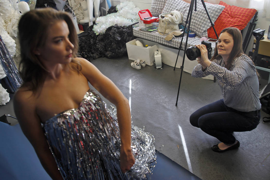 Jennifer Henry photographs Diana Care in a silver fringe dress at her studio at UNLV in Las Vegas, Thursday, Nov. 16, 2017. Rachel Aston Las Vegas Review-Journal @rookie__rae