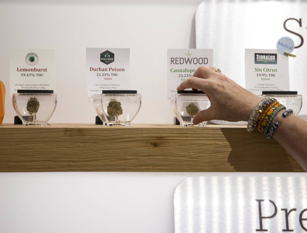Las Vegas resident Kris Counts samples the cannabis on display before making a purchase at The Source cannabis dispensary in Henderson on Friday, Oct. 20, 2017. Richard Brian Las Vegas Review-Jour ...