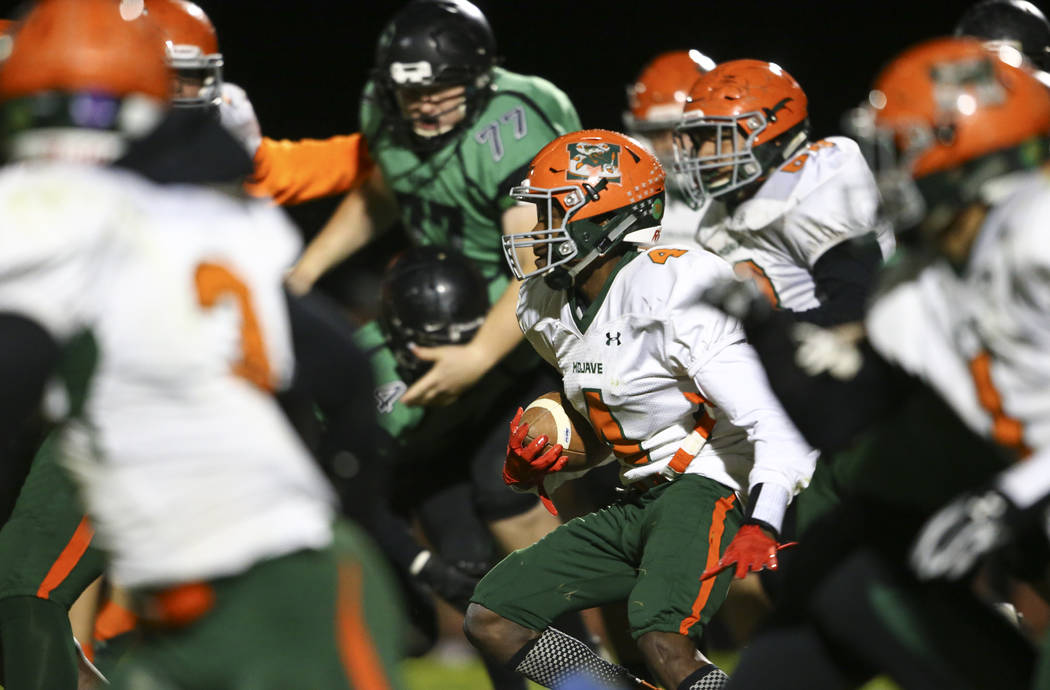 Mojave's Quincy Smith (4) moves the ball against Virgin Valley during the Class 3A state quarterfinal game at Virgin Valley High School in Mesquite on Thursday, Nov. 9, 2017. Chase Stevens Las Veg ...