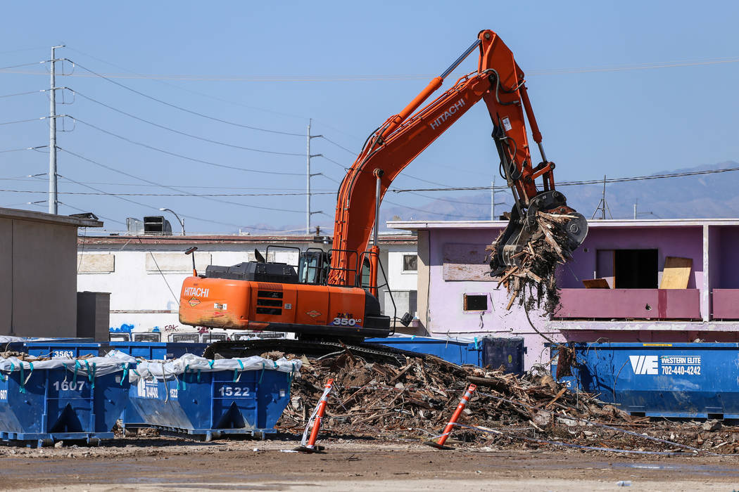 A crane lifts remnants of the demolished Moulin Rouge into dumpsters in Las Vegas, Thursday, Oct. 19, 2017. Joel Angel Juarez Las Vegas Review-Journal @jajuarezphoto