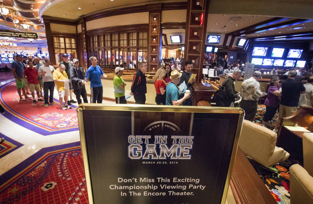 Bettors stand in line at Wynn Race and Sports Book during NCAA Men's basketball tournament  on Friday, March 21, 2014. (Jeff Scheid/Las Vegas Review-Journal)