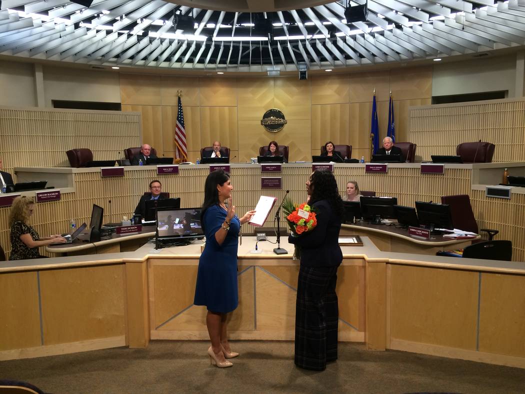 Henderson City Clerk Sabrina Mercadante, left, administers a ceremonial oath of office to newly appointed Police Chief LaTesha Watson. (City of Henderson/David Cherry)