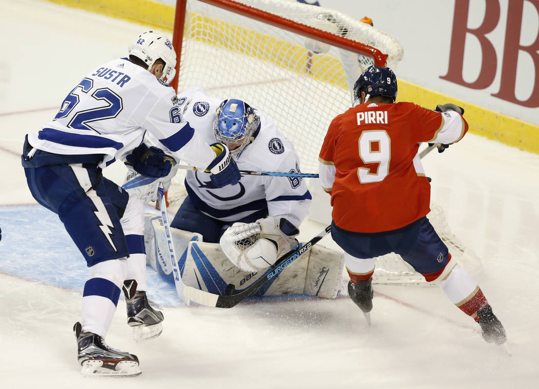 Florida Panthers center Brandon Pirri (9) attempts a shot against Tampa Bay Lightning defenseman Andrej Sustr (62) and goalie Andrei Vasilevskiy (88) during the second period of an NHL preseason h ...