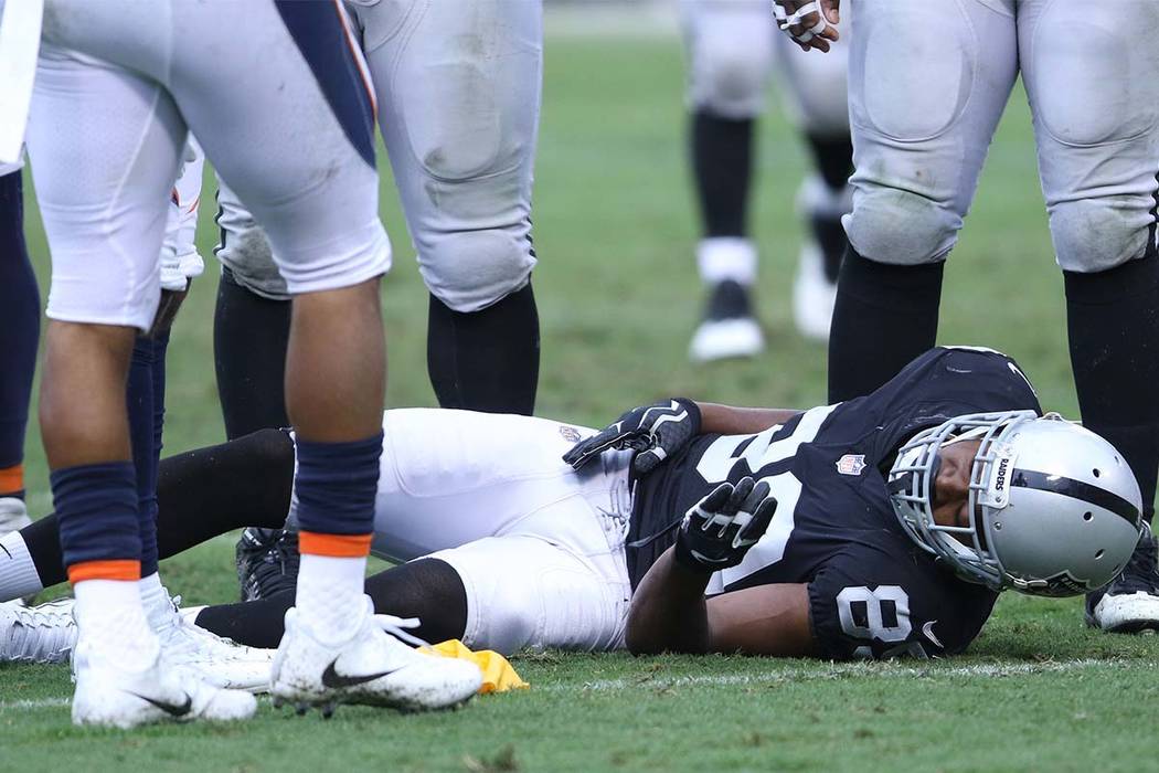 Oakland Raiders wide receiver Amari Cooper (89) lays on the field unconscious during the first half of a NFL game  against the Denver Broncos in Oakland, Calif., Sunday, Nov. 26, 2017. Heidi Fang  ...