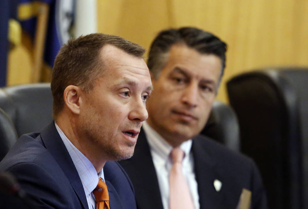 Gaming Control Board Chairman, A.G. Burnett, left, speaks as Gov. Brian Sandoval, looks on during the Gaming Policy Committee, which meets at the direction of the governor, discusses marijuana pol ...