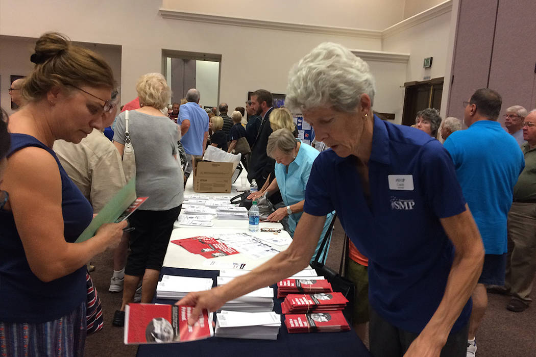 A member of the Nevada Senior Medicare Patrol hands out information Aug. 9, 2017. (Jan Hogan/View)