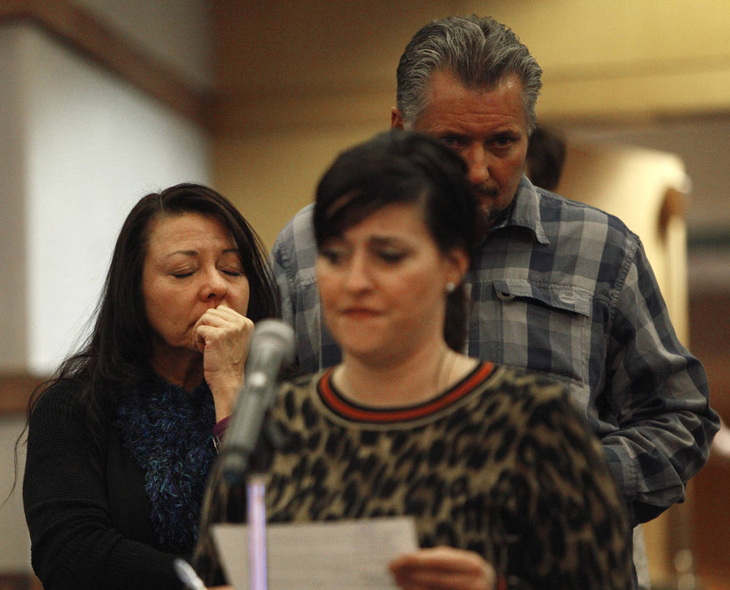 Yvonne Justice, a Route 91 survivor, closes her eyes as Merrily Caldwell, also a survivor, speaks to the Las Vegas Victims Fund committee at the Clark County Government Center in Las Vegas, Tuesda ...