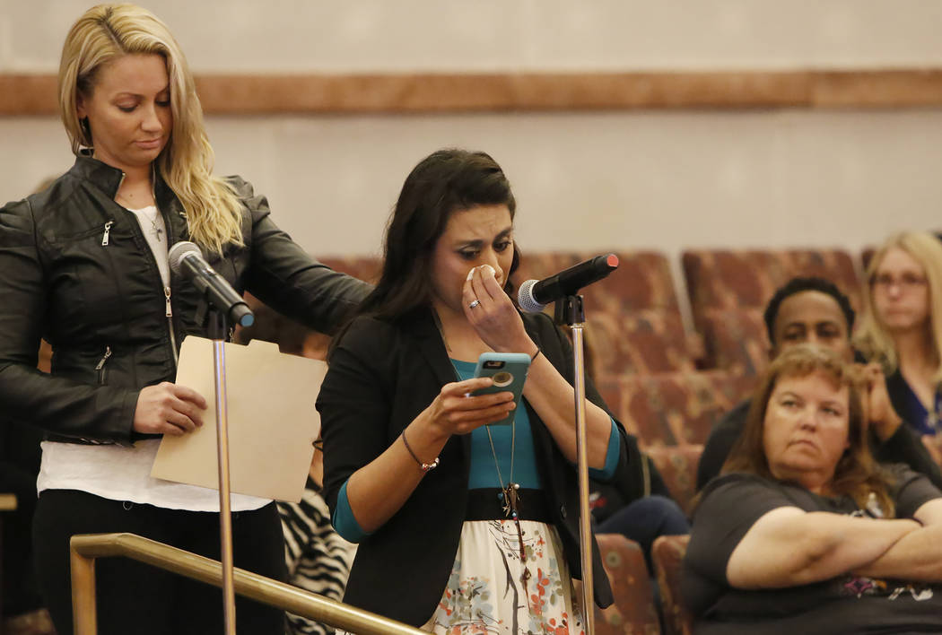 Lillian Aguirre, survivor of the Oct. 1 Las Vegas shooting, comforted by Laura Puglia, as she speaks before the Las Vegas Victims Fund committee Tuesday, Nov. 28, 2017, in Las Vegas. The Las Vegas ...