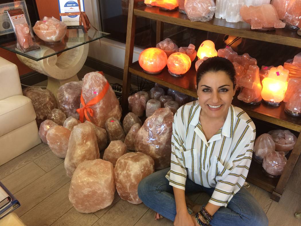 Ava Mucikyan, sits among her Himalayan salt lamps Nov. 1, 2017, while talking about her business, Salt Room LV, in Trails Village. She said she had to reinvent the business to keep it current. Her ...