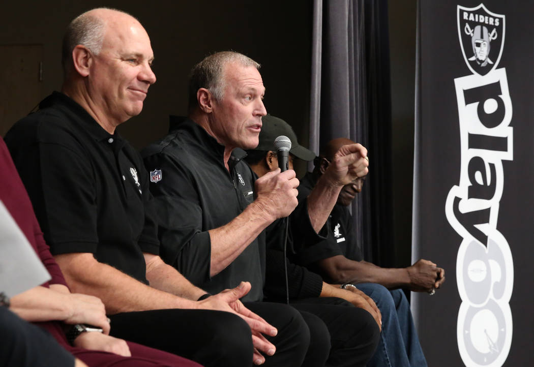 Jay Shroeder, left, a Raiders alumni, listens as Linden King speaks during the Raiders NFL Play 60 challenges event  at Josh Stevens Elementary School on Tuesday, Nov. 28, 2017, in Henderson. The  ...
