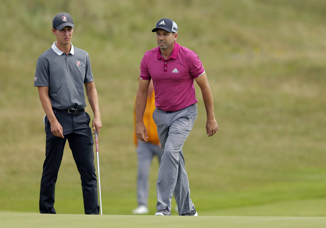 Spain's Sergio Garcia, left, and amateur golfer Maverick McNealy of the US walk up to the 5th green during a practice round ahead of the British Open Golf Championship, at Royal Birkdale, Southpor ...