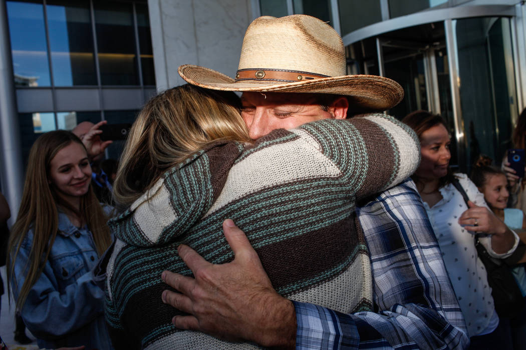 Ammon Bundy embraces a supporter outside the Lloyd George U.S. Courthouse in Las Vegas after being released from custody Thursday, Nov. 30, 2017. Bundy's trial related to a 2014 Bunkerville stando ...