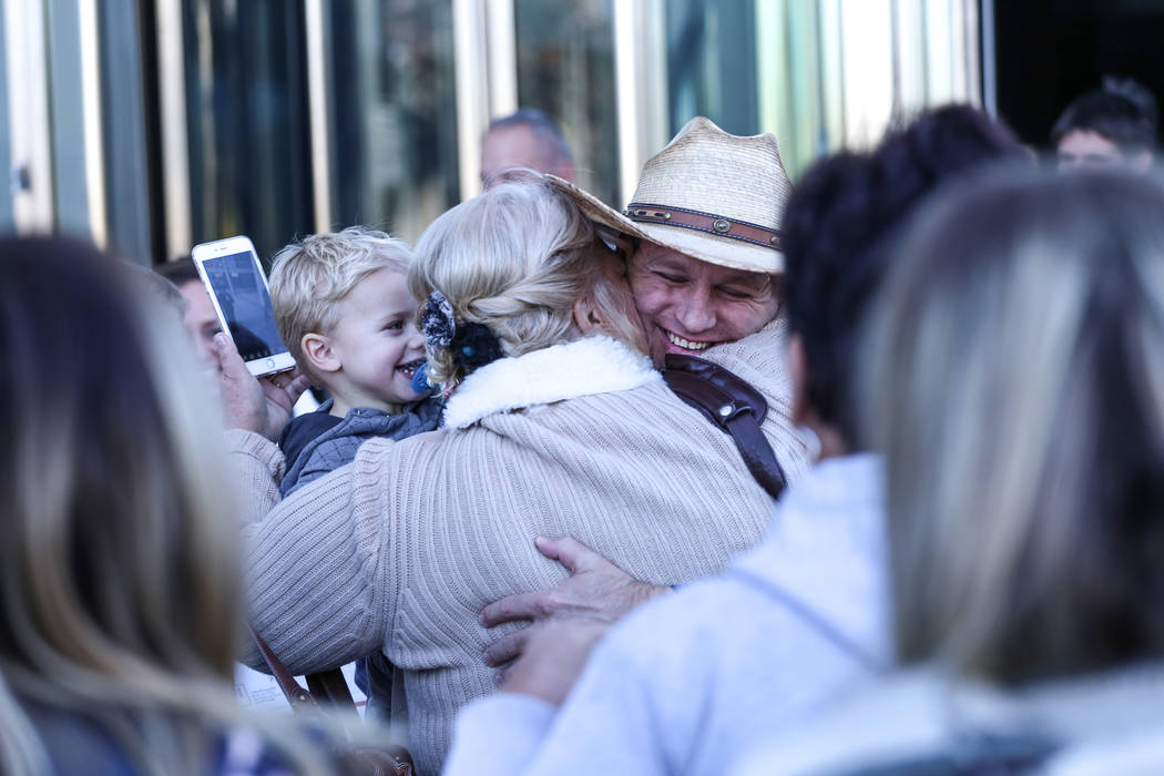 Ammon Bundy embraces supporters outside the Lloyd George U.S. Courthouse in Las Vegas, after being released from custody Thursday, Nov. 30, 2017. Bundy's trial related to a 2014 Bunkerville stando ...