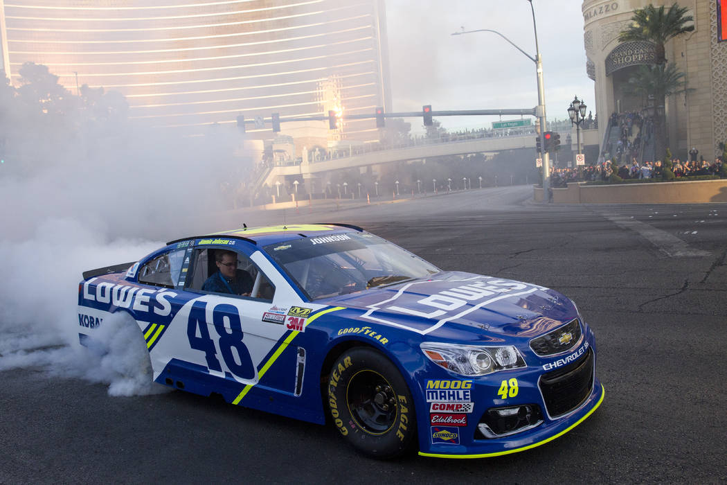 Race car driver Jimmie Johnson (48) burns out on the Vegas Strip during NASCAR's Victory Lap on Wednesday, Nov. 29, 2017. Richard Brian Las Vegas Review-Journal @vegasphotograph