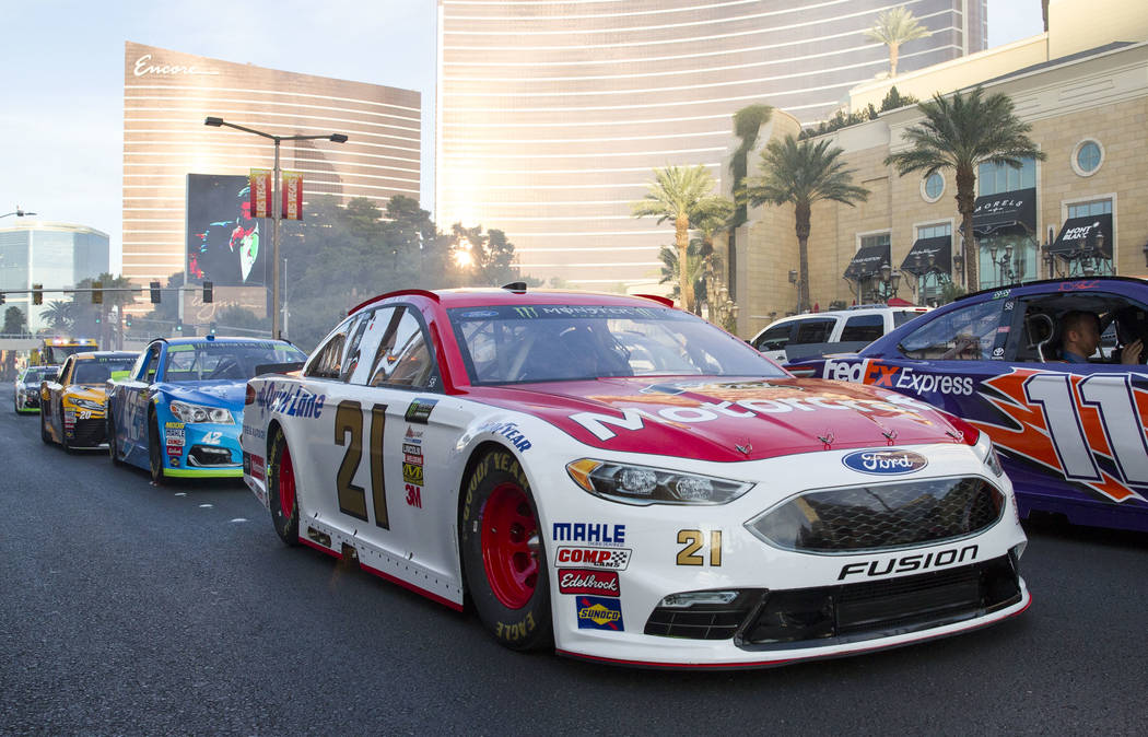 Race car driver Ryan Blaney (21) and other drivers take a lap on the Vegas Strip during NASCAR's Victory Lap on Wednesday, Nov. 29, 2017. Richard Brian Las Vegas Review-Journal @vegasphotograph