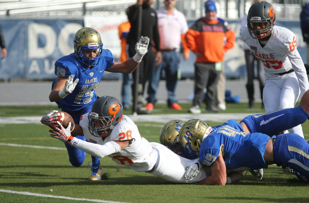 Bishop Gorman’s Amod Cianelli dives for the goal line during the first half of the NIAA 4A state championship football game in Reno, Nev., on Saturday, Dec. 2, 2017. Cathleen Allison/Las Ve ...