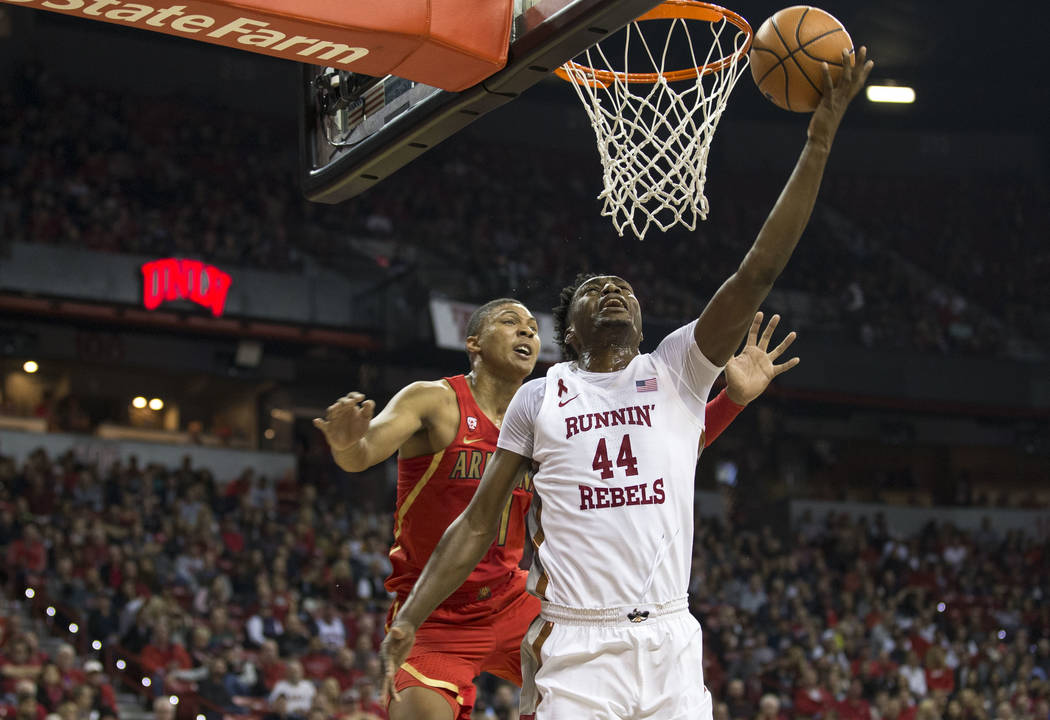 UNLV Rebels forward Brandon McCoy (44) shoots for a point against Arizona  Wildcats forward Ira Lee (11) during the first half of an NCAA college  basketball game at Thomas & Mack Center