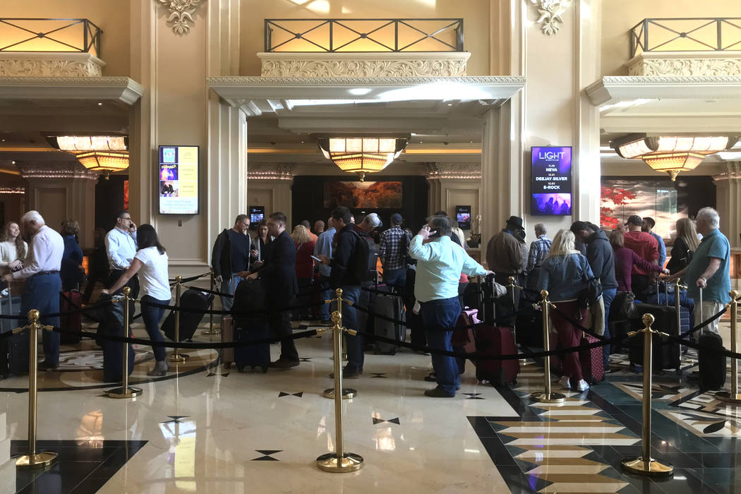Visitors wait in a long line to check in at Mandalay Bay hotel-casino in Las Vegas, Tuesday, Nov. 28, 2017. Bridget Bennett Las Vegas Review-Journal