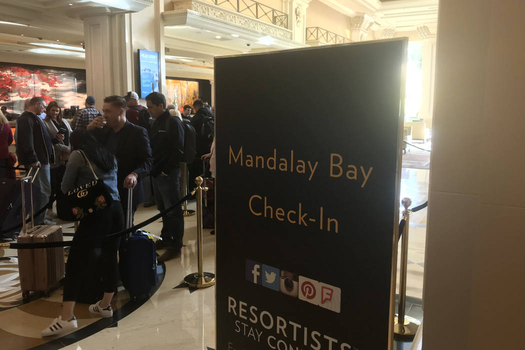 Visitors wait in a long line to check in at Mandalay Bay hotel-casino in Las Vegas, Tuesday, Nov. 28, 2017. Bridget Bennett Las Vegas Review-Journal