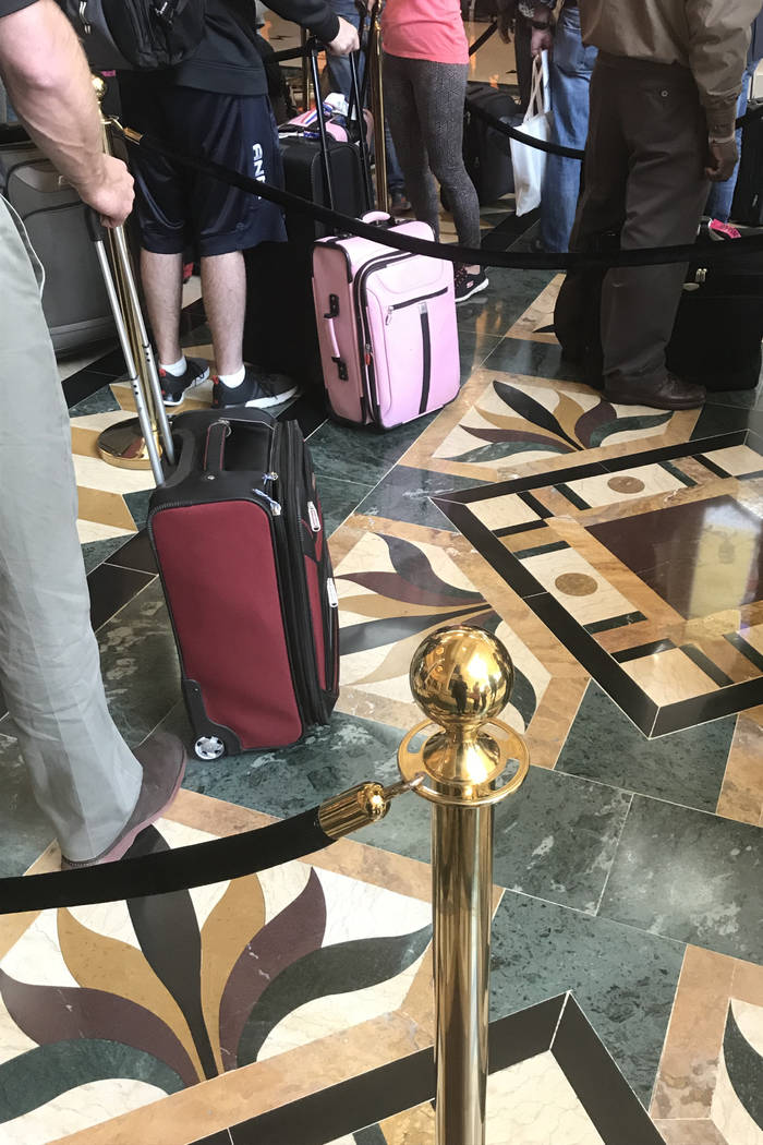 Visitors wait in a long line to check in at Mandalay Bay hotel-casino in Las Vegas, Tuesday, Nov. 28, 2017. Bridget Bennett Las Vegas Review-Journal