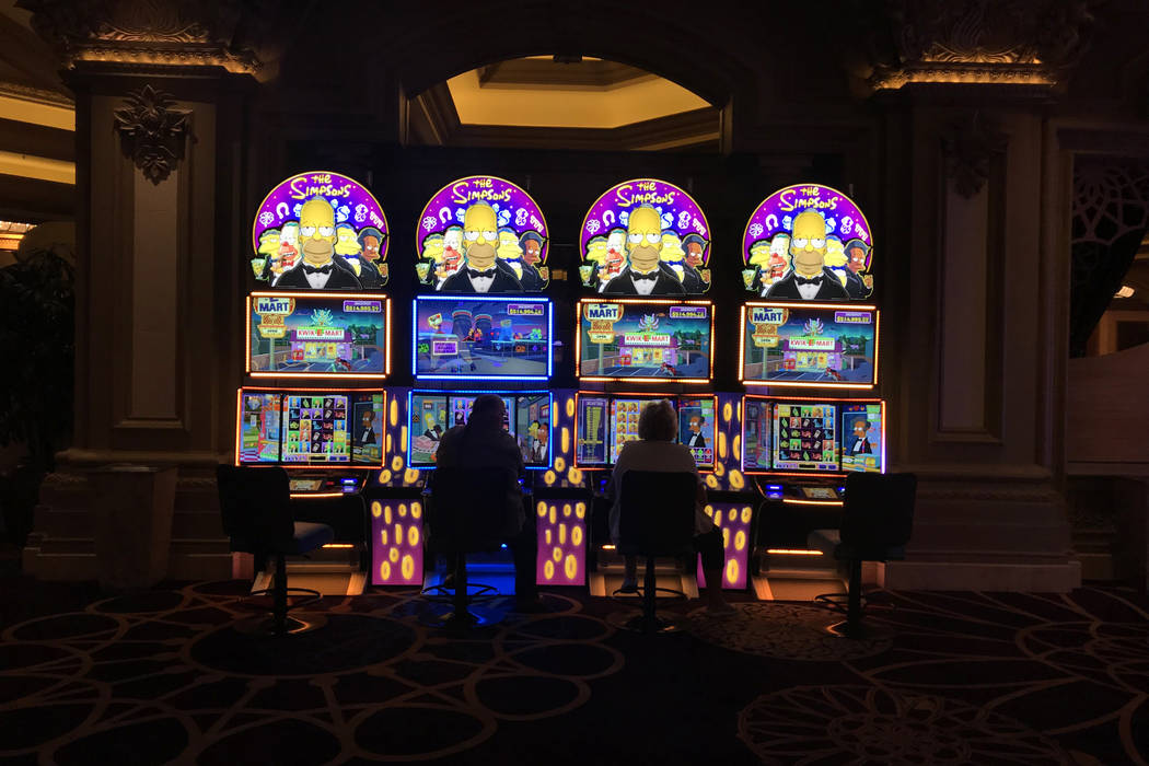 A couple play machines at Mandalay Bay hotel-casino in Las Vegas, Tuesday, Nov. 28, 2017. Bridget Bennett Las Vegas Review-Journal