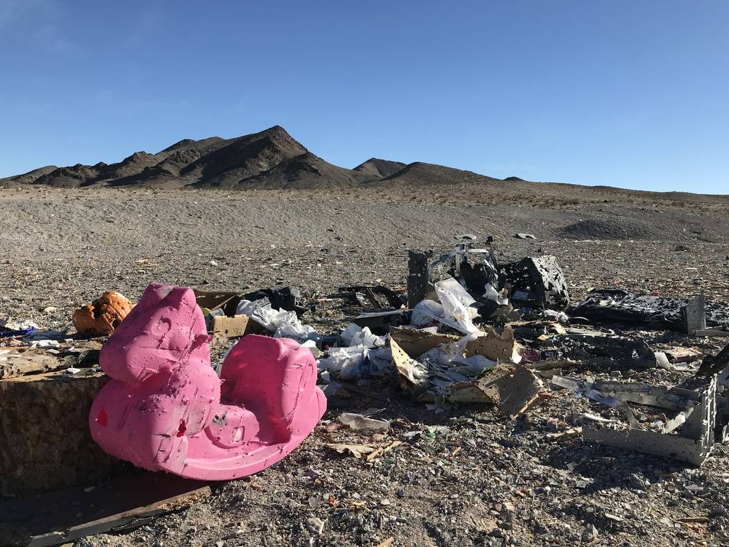 A plastic rocking horse and other debris litters a popular target shooting area on public land just south of the Las Vegas Valley, Tuesday, Nov. 28, 2017. Henry Brean Las Vegas Review-Journal